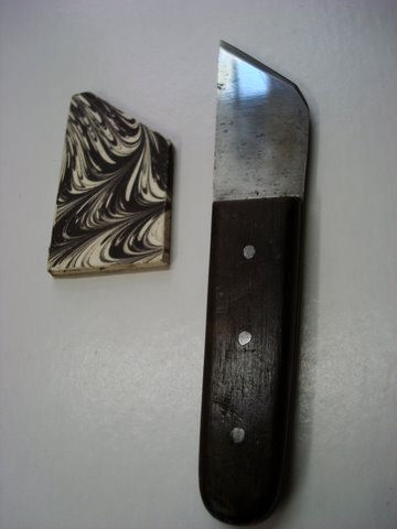 Old German steel blade knife retooled as a right hand paring knife with decorative marbled cap.