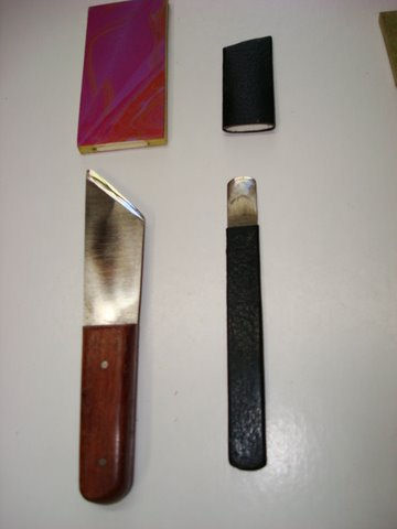 English style right hand paring knife on left with cap. On right is a French style rounded knife for paring or scraping with cap.