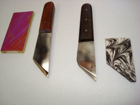 Retooled German steel knives with marbled caps.